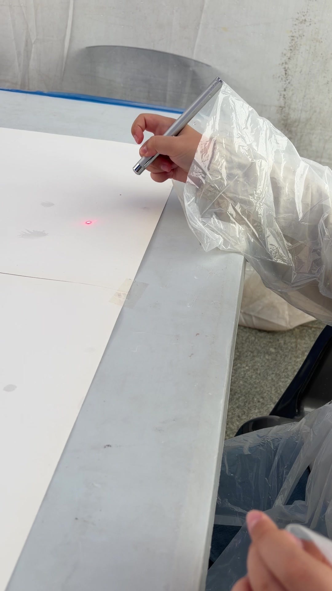 A child aiming a laser pen during the activity