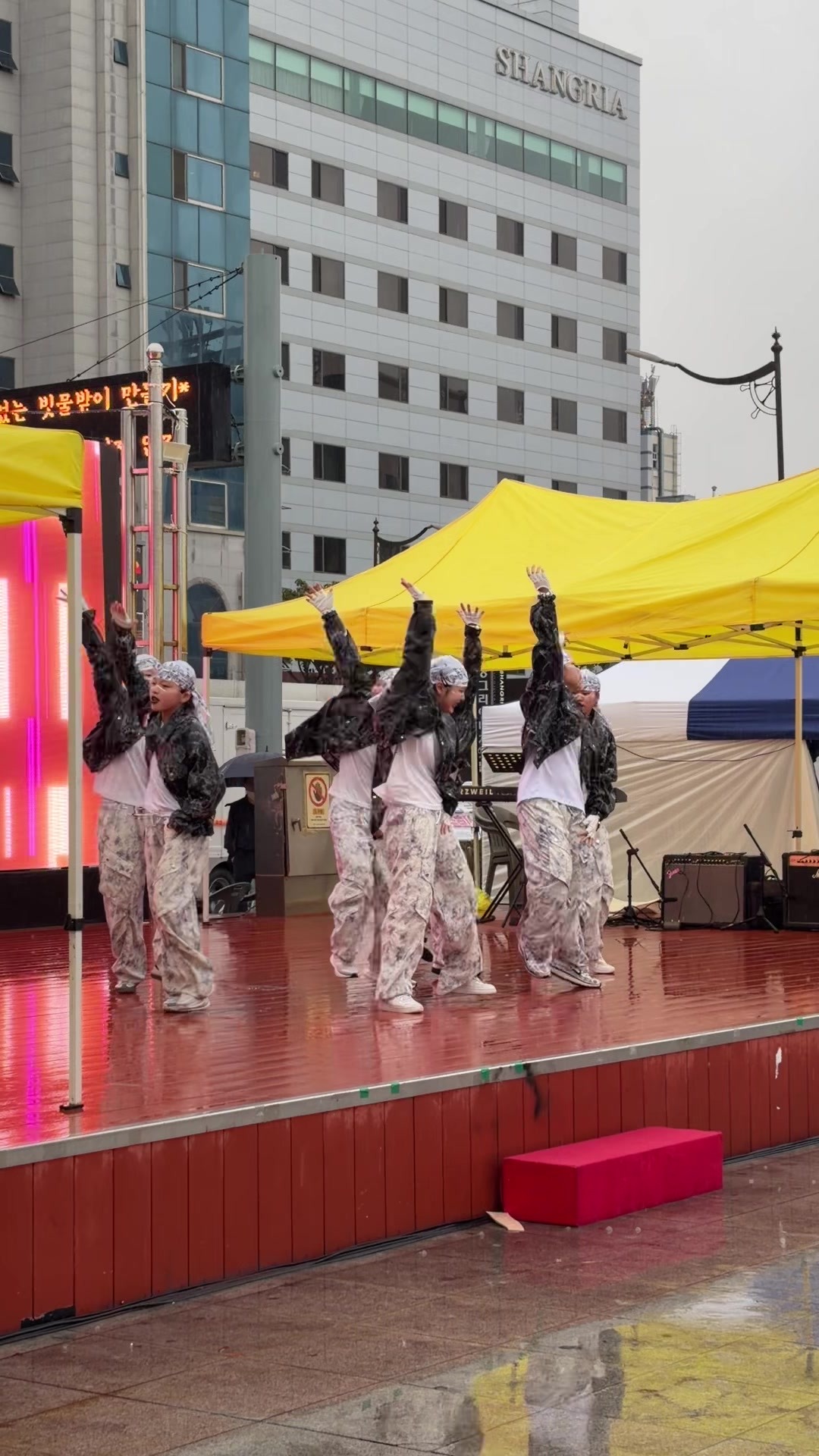 Dance team Excited at the finale of the rainy stage performance